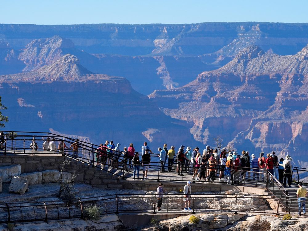  Tourists flock to Mather Point at Grand Canyon National Park, Oct. 1, 2025, in Grand Canyon, Ariz.