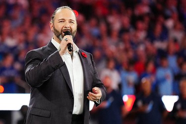 David Grenon performs O Canada before Game 6 of the 2025 World Series in Toronto on Oct. 31, 2025.