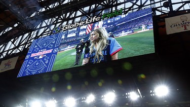 Country singer Ingrid Andress sings The Star-Spangled Banner before an MLB game in Arlington, Texas, on July 15, 2024.