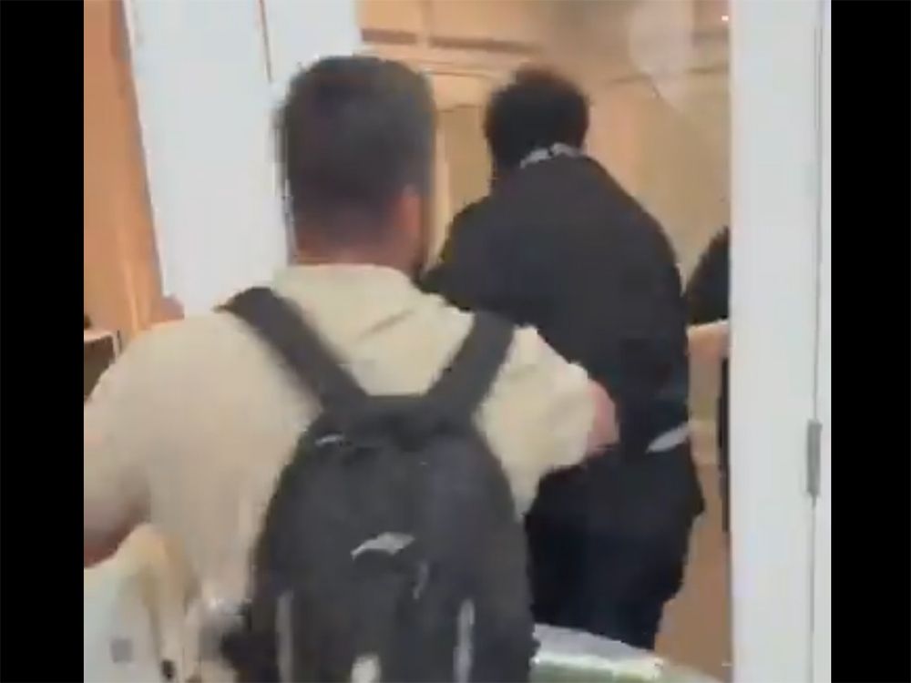 This screenshot from a video taken at the Students Supporting Israel event on Nov. 5, 2025 shows a man pushing back an anti-Israel protester who broke through a glass door. This screenshot from a video taken at the Students Supporting Israel event on Nov. 5, 2025 shows a man pushing back an anti-Israel protester who broke through a glass door.