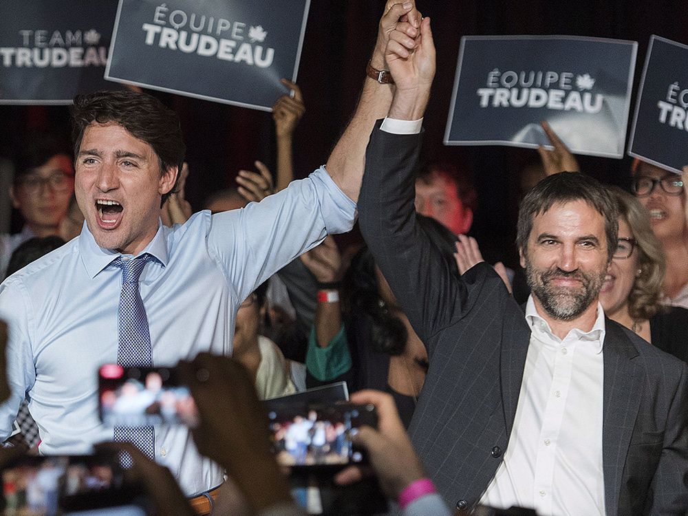 Then Prime Minister Justin Trudeau, left, raises the hand of Steven Guilbeault during an event to launch Guilbeault’s candidacy for the federal Liberal party, in Montreal on July 10, 2019.