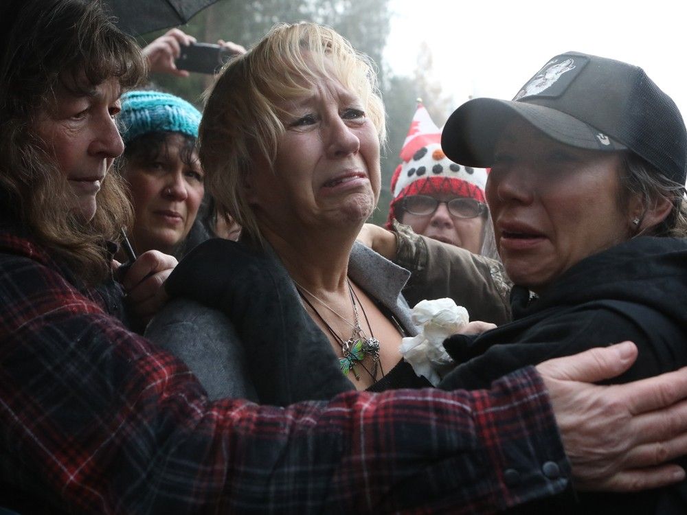 Karen Espersen, the co-owner of Universal Ostrich Farms, is embraced by supporters and her daughter, Katie Pasitney, at the farm in Edgewood, B.C., on Thursday, Nov. 6, 2025. Karen Espersen, the co-owner of Universal Ostrich Farms, is embraced by supporters and her daughter, Katie Pasitney, at the farm in Edgewood, B.C., on Thursday, Nov. 6, 2025.