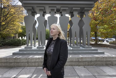 Professor Tara Burke in front of the The Pillars of Justice Statue at the 361 University Avenue Courthouse in Toronto, Wednesday October 22, 2025.