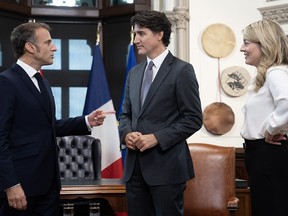 Mélanie Joly with Trudeau and Macron