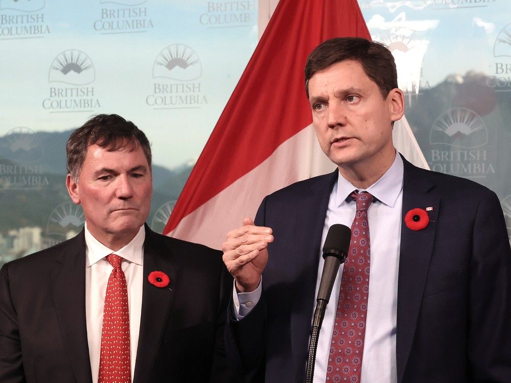 B.C. Premier David Eby talks to the media alongside federal Minister responsible for Canada-U.S. Trade, Intergovernmental Affairs, Dominic LeBlanc in Vancouver on Nov. 3.
