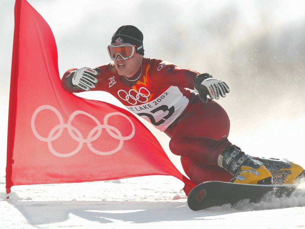  Ryan Wedding of Canada competes in the qualifying round of the men’s parallel giant slalom snowboarding event during the Salt Lake City Winter Olympic Games in Park City, Utah. 