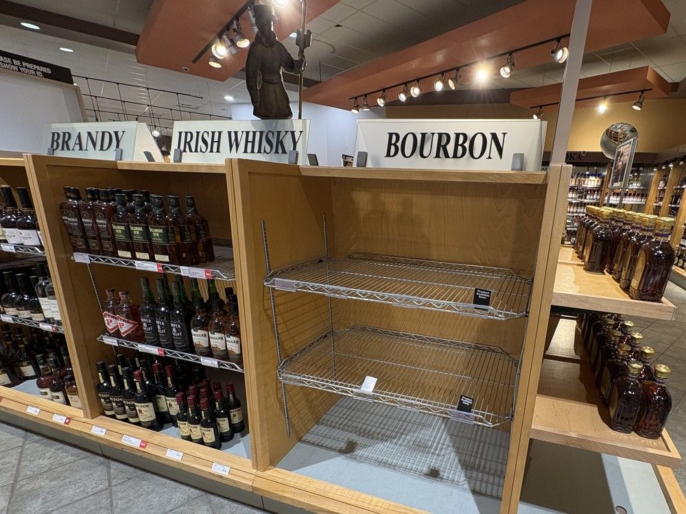 Empty shelves where U.S.-made bourbon once sat at a P.E.I. liquor store. The province is one of four returning existing U.S. stock to shelves and donating net profits from their sale to charity.