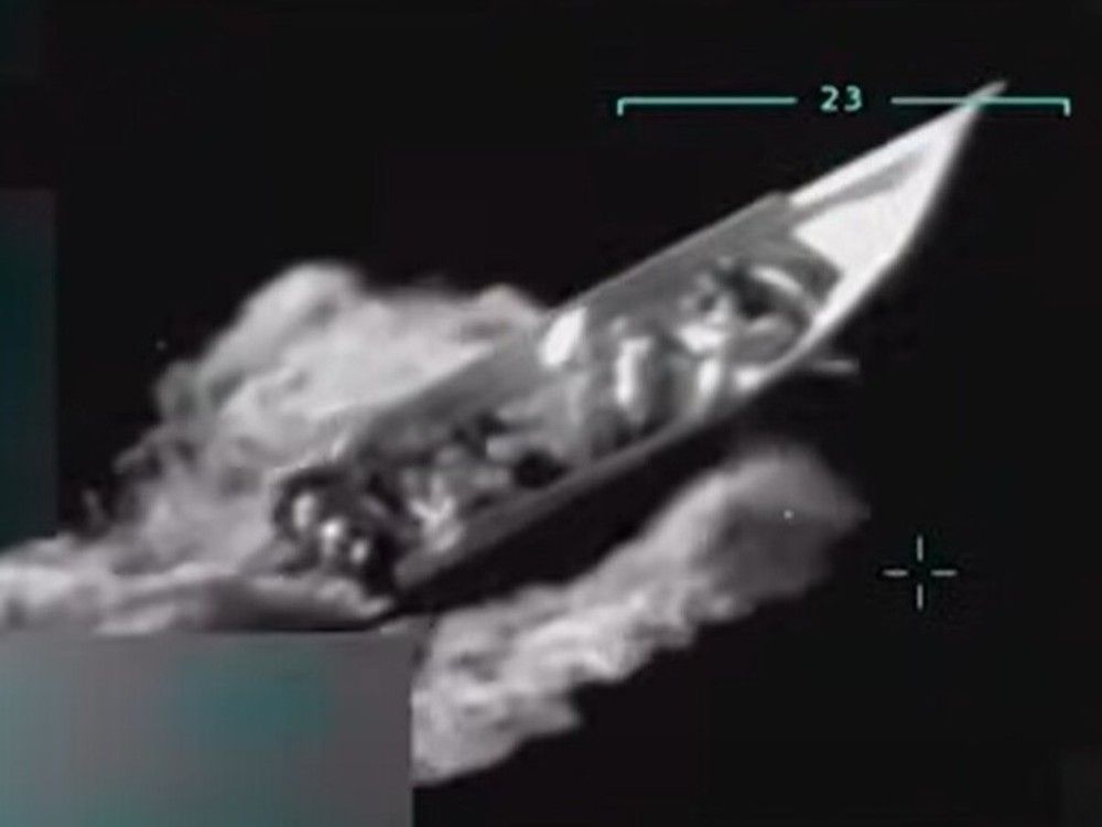  Screenshot of a video shared by U.S. President Donald Trump showing a speedboat carrying people before it was hit with a lethal air strike and exploded.