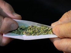 hands rolling a joint