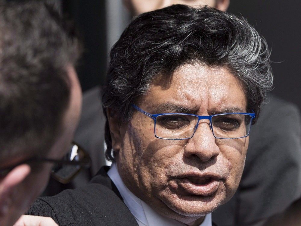 Deepak Paradkar leaves a courthouse in Hamilton, Ont., in April 2017.