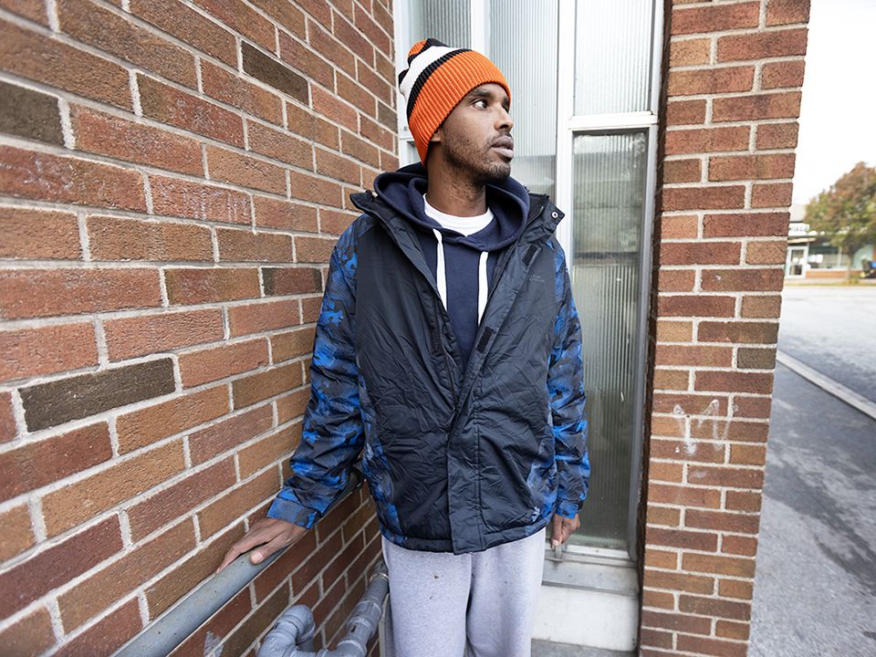 A homeless man named Abdullah Yaya who says he is a refugee from Somalia, stands outside The Salvation Army in St. Catharines.