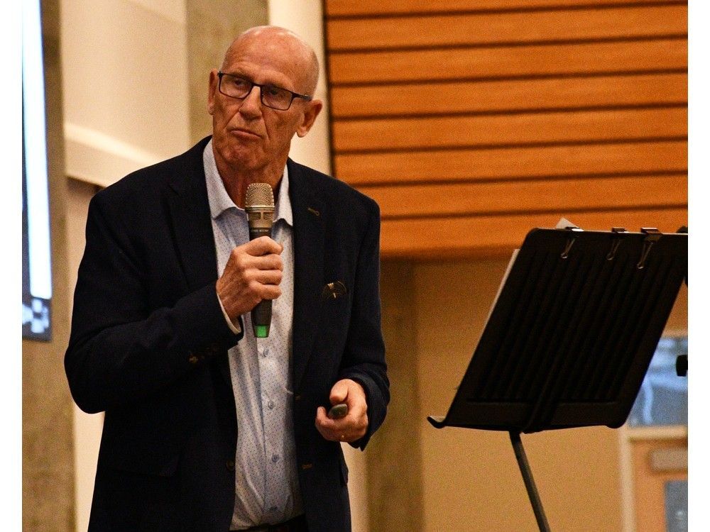 Mitch Sylvestre, CEO of the Alberta Prosperity Project, displays an image taken during the Holocaust while drawing comparisons between the current economic situation in Alberta and Nazi Germany. Sylvestre spoke at an event hosted by the Alberta Prosperity Project on March 18, 2025, in Strathcona County.