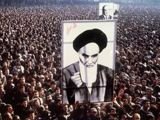 A photograph taken in January 1979 shows Iranian protesters holding up a poster of Ayatollah Ruhollah Khomeini.