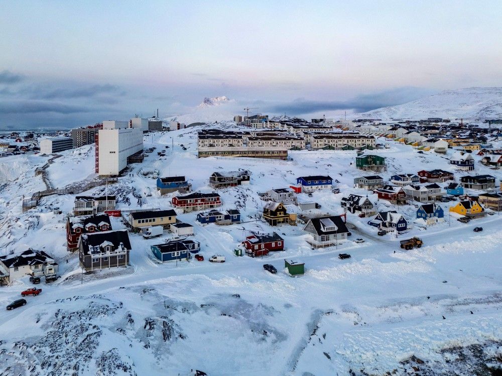  This aerial view shows snow-covered buildings in Nuuk, Greenland, on March 7, 2025.