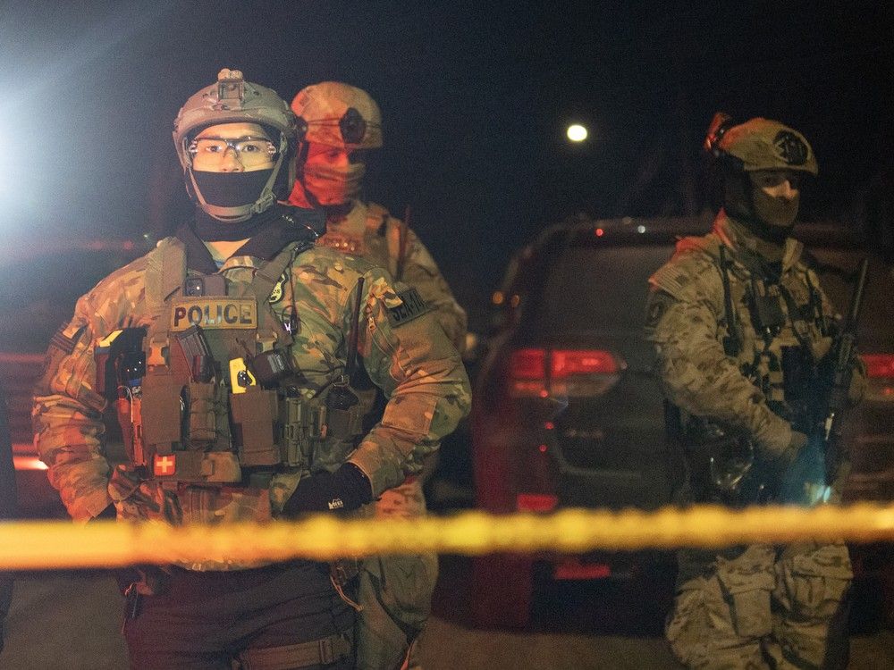 Federal agents behind police tape