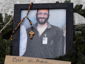 A picture of Alex Pretti is left at a makeshift memorial
