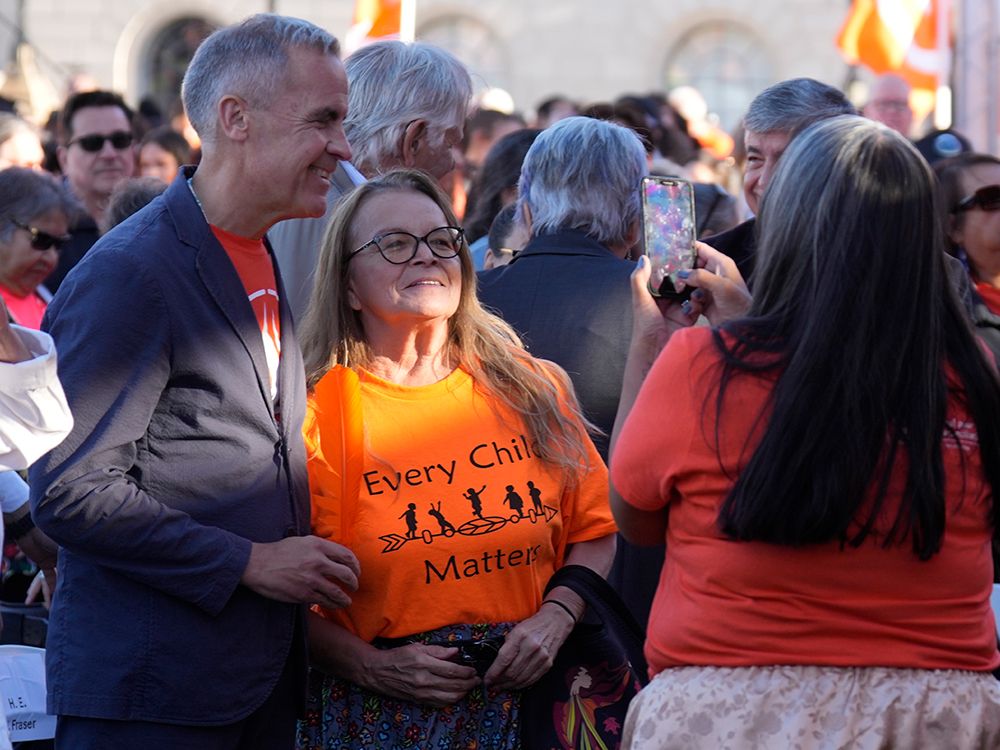 Prime Minister Mark Carney poses for a photo following ceremonies marking the National Day for Truth and Reconciliation on Parliament Hill on Sept. 30, 2025.