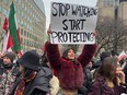 People protest the Iranian regime outside the U.S. Consulate in downtown Toronto on Jan. 13, 2026.