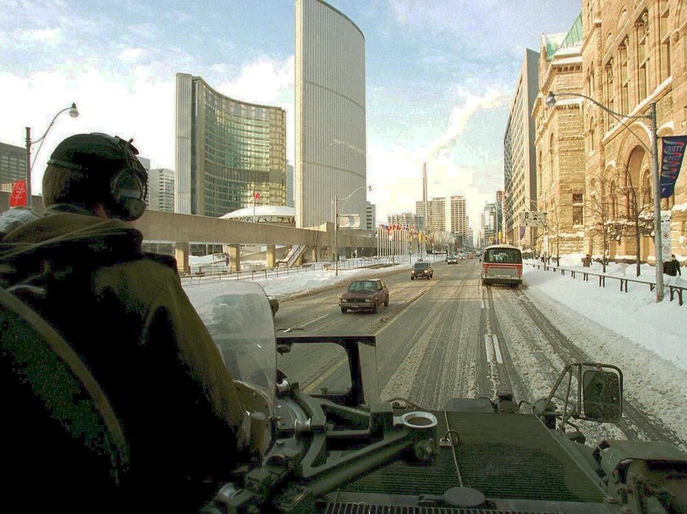  Canadian Army officer John Dunn patrols downtown Toronto on Jan. 15, 1999, in an armoured personnel carrier following heavy snow and frigid temperatures in eastern and central Canada.