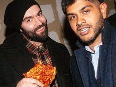 Slava and Ali pose for a photo together