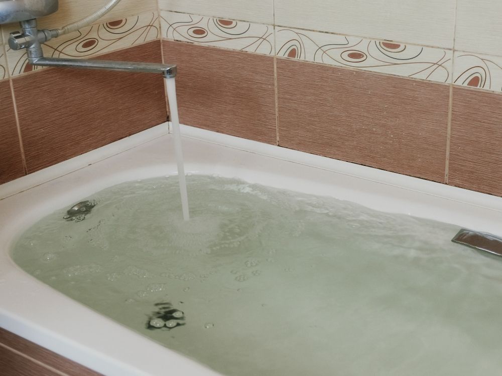 Stock image of a full bathtub.