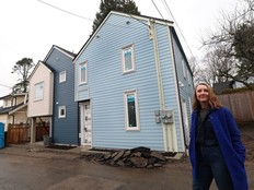 Akua Schatz, co-owner of Smallworks, in front of one of the multi-unit developments the company is constructing in Vancouver.