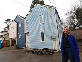 Akua Schatz, co-owner of Smallworks, in front of one of the multi-unit developments the company is constructing in Vancouver.