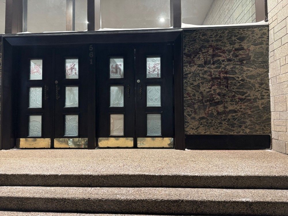  Another angle shows a synagogue in Winnipeg that was vandalized after a suspect spray-painted swastikas on its windows and walls on Jan. 2, 2026.