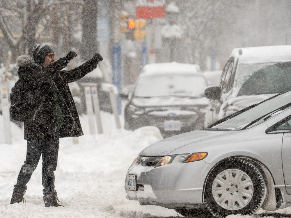 Snow piled high, cars completely covered: Canadians capture record-breaking winter storm in Toronto