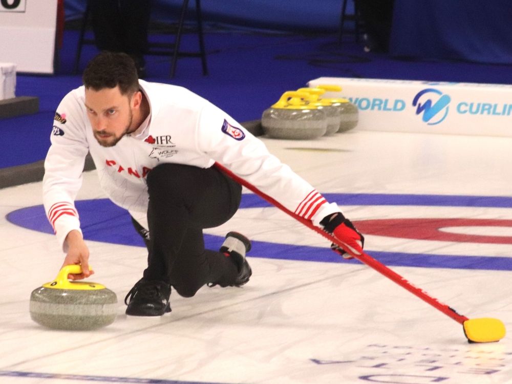 Brett Gallant makes a shot at the 2025 world mixed doubles championship in Fredericton. Gallant, who is from Charlottetown, and his wife, Jocelyn Peterman, will represent Canada in mixed doubles curling at the 2026 Olympic Winter Games in Italy.