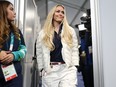 Lindsey Vonn of Team United States enters the media room prior to a press conference at Cortina Curling Olympic Stadium on Feb. 3, 2026.