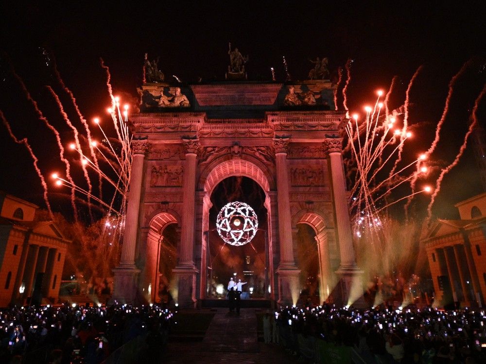 The Olympic flame is lit in the cauldron designed by Marco Balich during the opening ceremony of the Milano Cortina 2026 Winter Olympic Games next to the Arco della Pace monument in Milan on Friday. The Olympic flame is lit in the cauldron designed by Marco Balich during the opening ceremony of the Milano Cortina 2026 Winter Olympic Games next to the Arco della Pace monument in Milan on Friday.