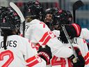 Team Canada forward Emily Clark celebrates with teammates after scoring a goal during the women's preliminary round match against Finland during the Milano Cortina 2026 Winter Olympic Games.