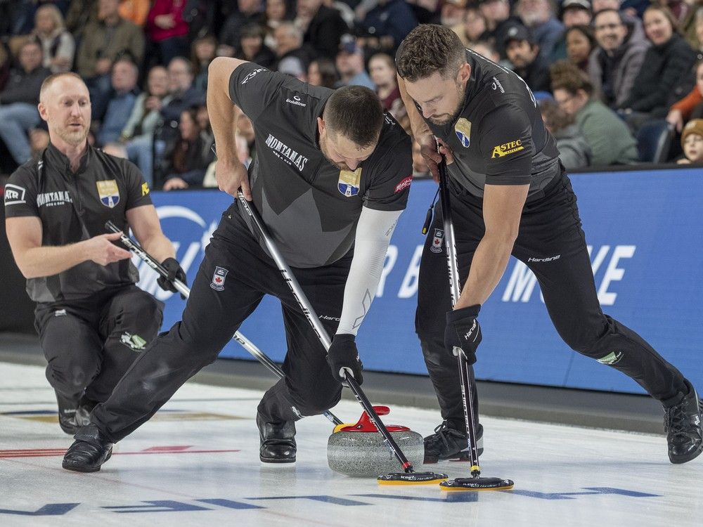 Brett Gallant, right, and Ben Hebert sweep a shot by skip Brad Jacobs during play in the 2025 Montana's Canadian Olympic Curling Trials in Halifax.