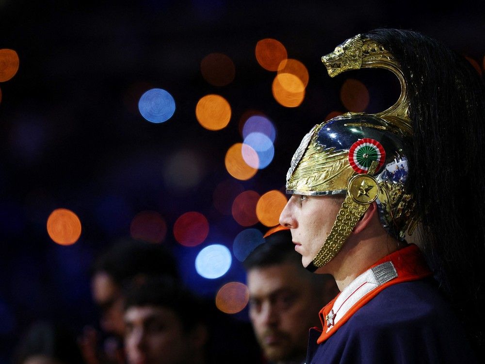 A members of The Corazzieri, the Italian Corps of Cuirassiers stands at attention during the opening ceremony of the Milano Cortina 2026 Winter Olympic Games in Milan, northern Italy, on Feb. 6, 2026. A members of The Corazzieri, the Italian Corps of Cuirassiers stands at attention during the opening ceremony of the Milano Cortina 2026 Winter Olympic Games in Milan, northern Italy, on Feb. 6, 2026.