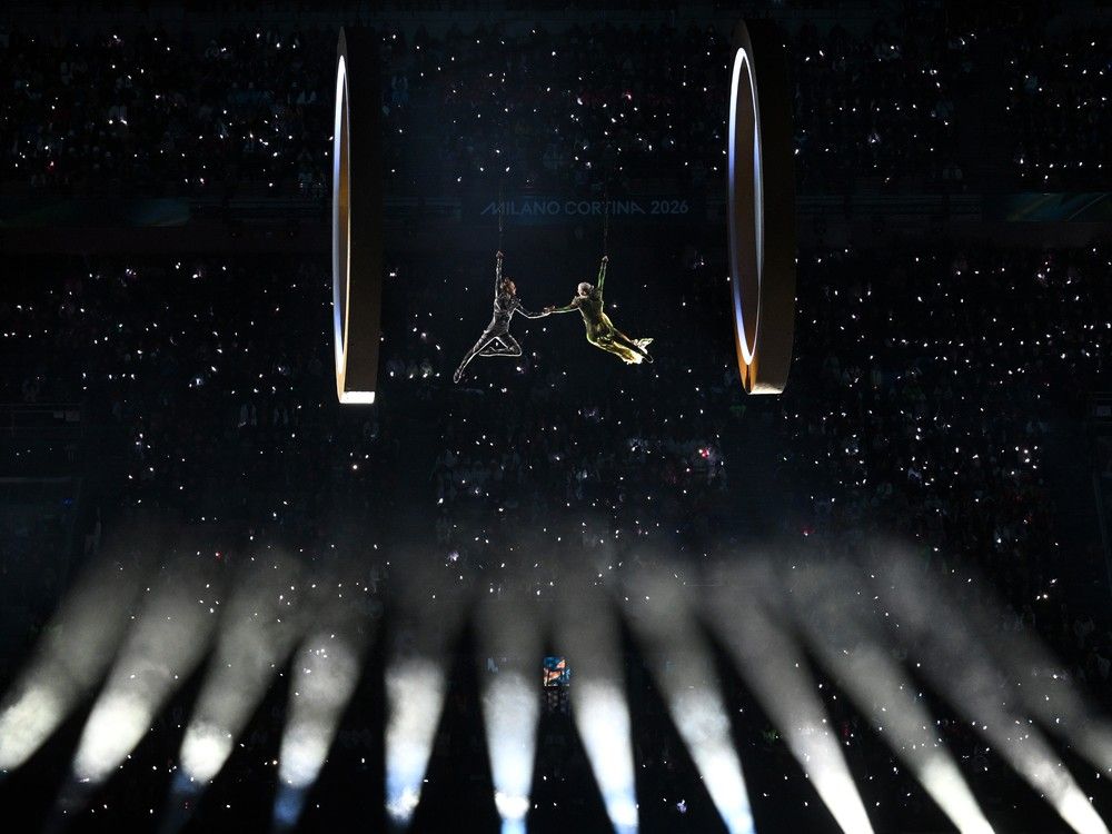 Two aerial actors perform next to the rings representing the city and mountain during the opening ceremony of the Milano Cortina 2026 Winter Olympics at San Siro Stadium on Feb. 06, 2026 in Milan, Italy. Two aerial actors perform next to the rings representing the city and mountain during the opening ceremony of the Milano Cortina 2026 Winter Olympics at San Siro Stadium on Feb. 06, 2026 in Milan, Italy.