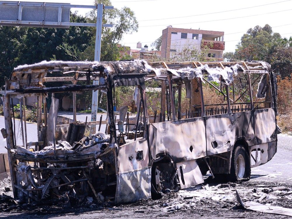  A view of a burnt bus on a deserted street on February 22, 2026 in Zapopan, Mexico.