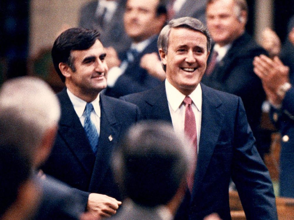  Lucien Bouchard enters the House of Commons for the first time as an MP, accompanied by then prime minister Brian Mulroney, June 28, 1988.
