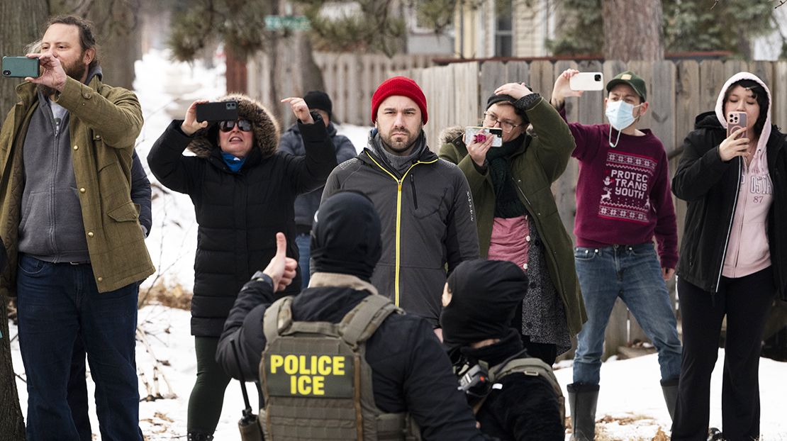 Observers film ICE agents in Minneapolis, Minn., on Feb. 5, 2026.