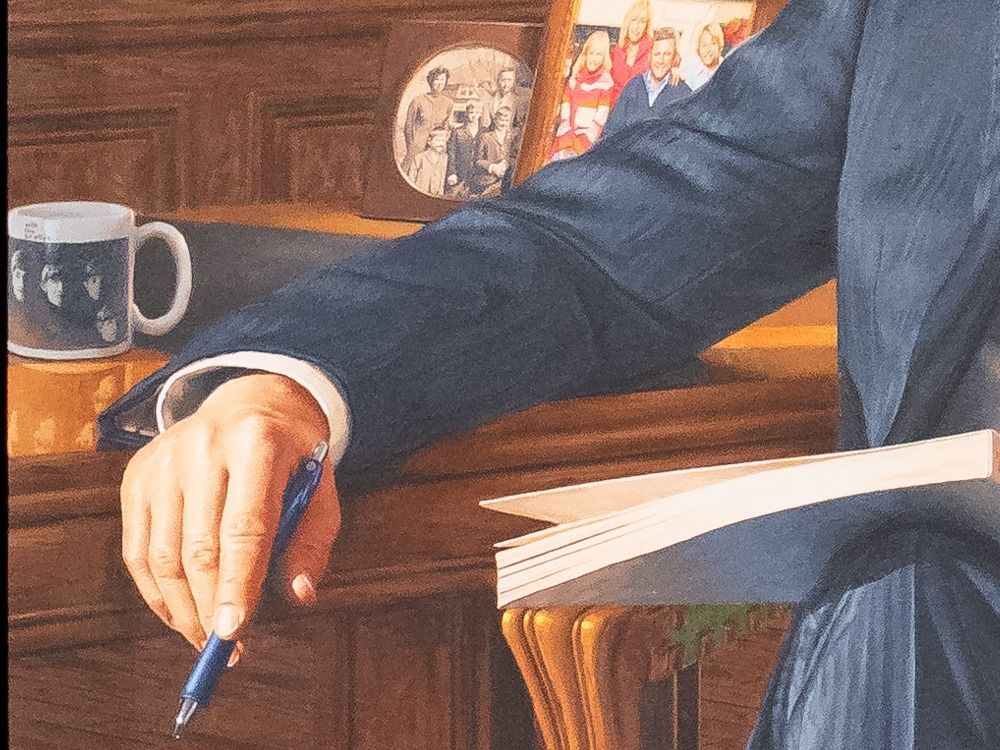  A detail of the portrait shows a Beatles mug, two family photos and Harper’s one-millimetre pen.