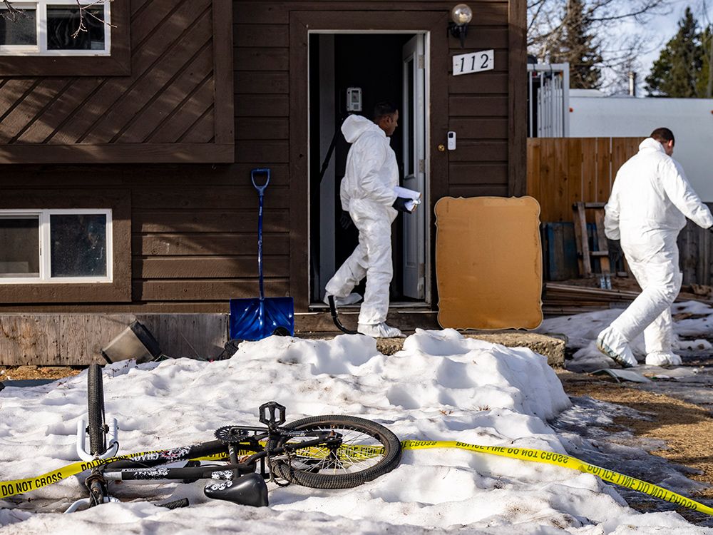  Police investigators work at the house where mass shooter Jesse Van Rootselaar lived and the bodies of Jennifer Jacobs and her son Emmett Jacobs, 11, were found, in Tumbler Ridge, B.C., on Thursday, Feb. 12, 2026.
