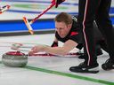 Canada's Marc Kennedy in action during the men's curling round robin session against Sweden, at the 2026 Winter Olympics on Friday, Feb. 13, 2026.