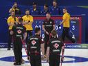 Canada's Brad Jacobs, Marc Kennedy, Brett Gallant, and Ben Hebert in action during the men's curling round robin session against Sweden, at the 2026 Winter Olympics, in Cortina d'Ampezzo, Italy.