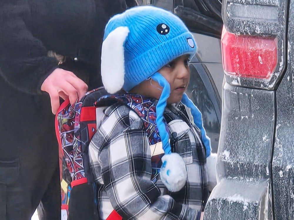 A boy with a blue hat