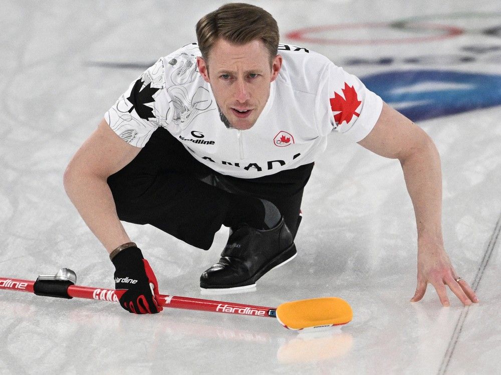 Canada's Marc Kennedy competes in the curling men's round robin between Switzerland and Canada during the Olympics.