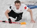 Canada's Marc Kennedy competes in the curling men's round robin between Switzerland and Canada during the Olympics.