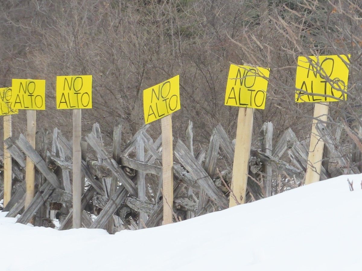 Signs opposing the Alto high-speed rail project line a fence along Dewey Road in Stone Mills Township, Ont. on Tuesday, March 3, 2026.