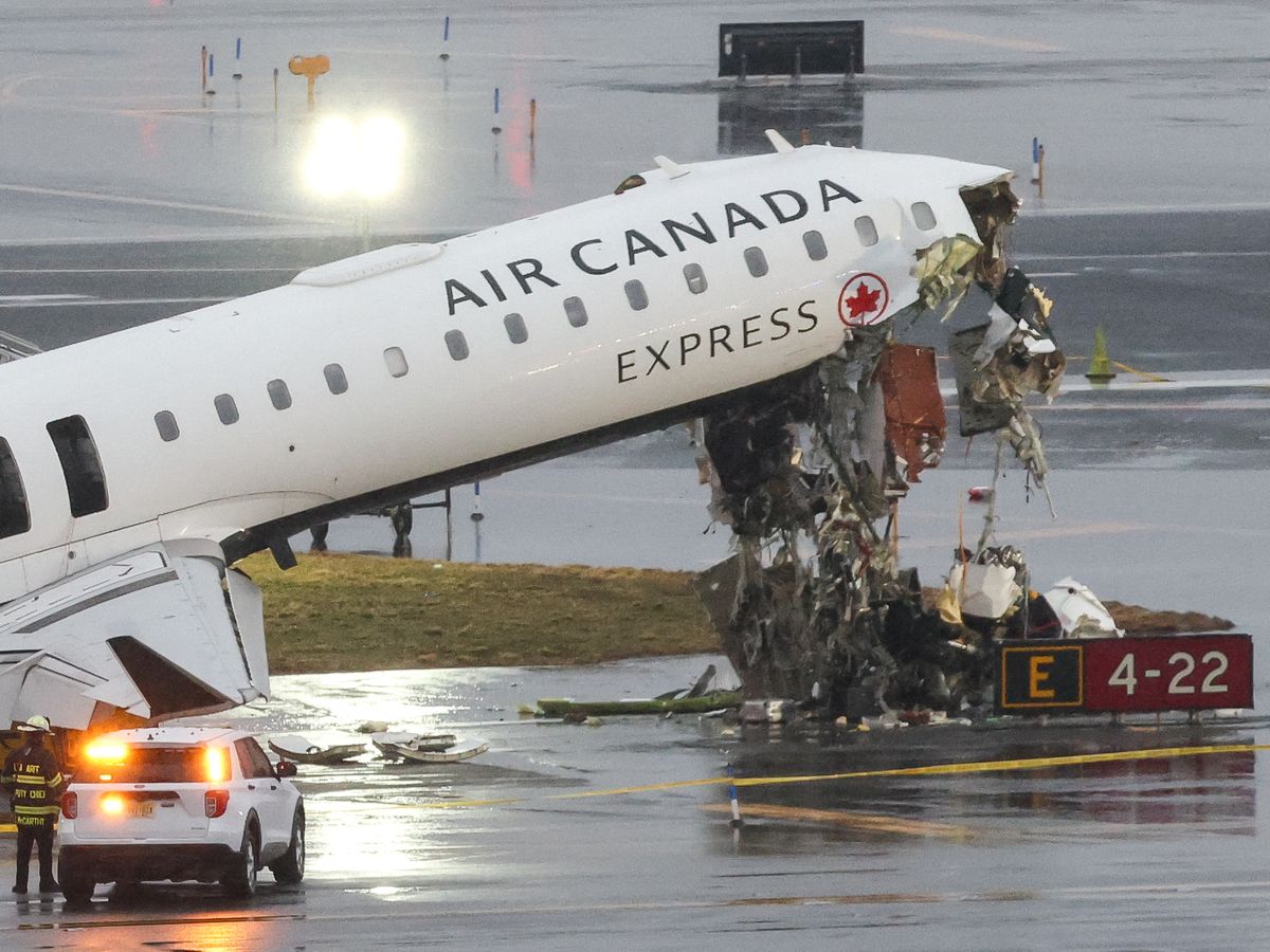 The two pilots on the Air Canada flight were killed and dozens were injured when the jet hit a fire truck at New York's LaGuardia airport.