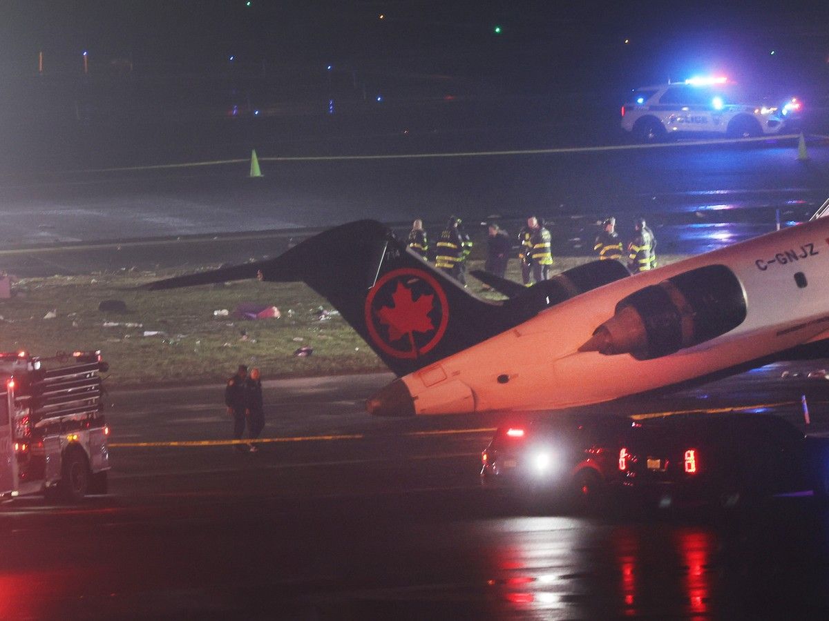 An Air Canada Express plane sits on the tarmac after it collided with a fire truck on the tarmac at LaGuardia Airport on March 23, 2026 in New York City. An Air Canada Express plane sits on the tarmac after it collided with a fire truck on the tarmac at LaGuardia Airport on March 23, 2026 in New York City.