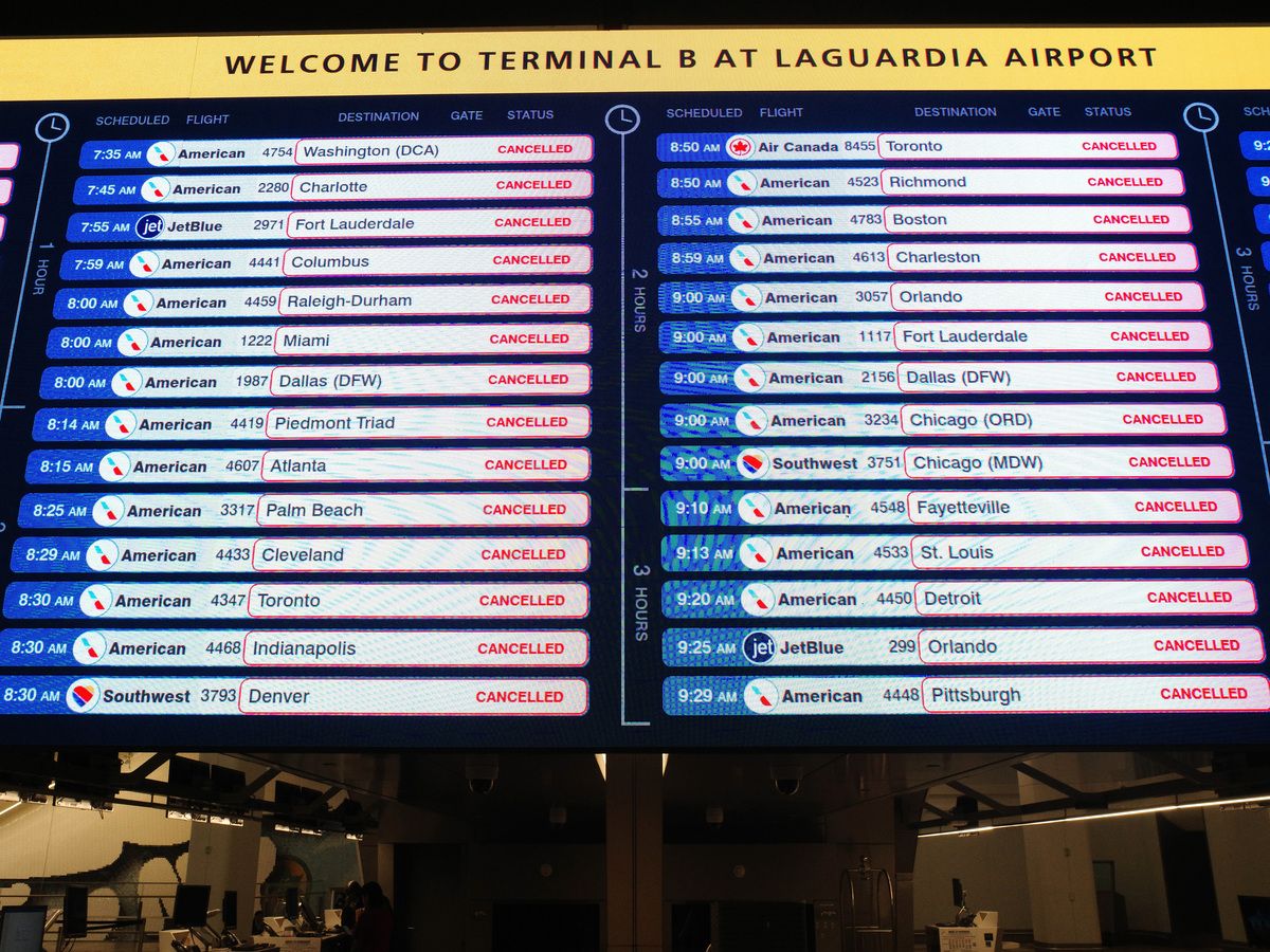  Cancelled flights are displayed on a screen at Terminal B in LaGuardia Airport on March 23, 2026 in New York City.